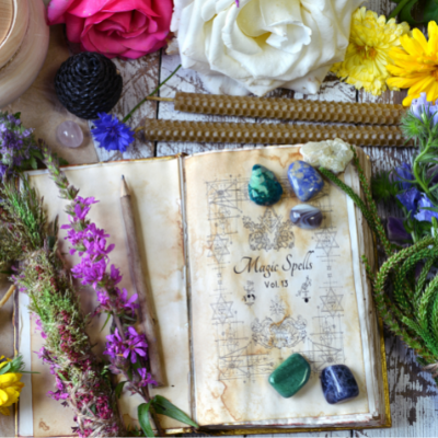 Magickal spell book of shadows, herbs, and stones.
